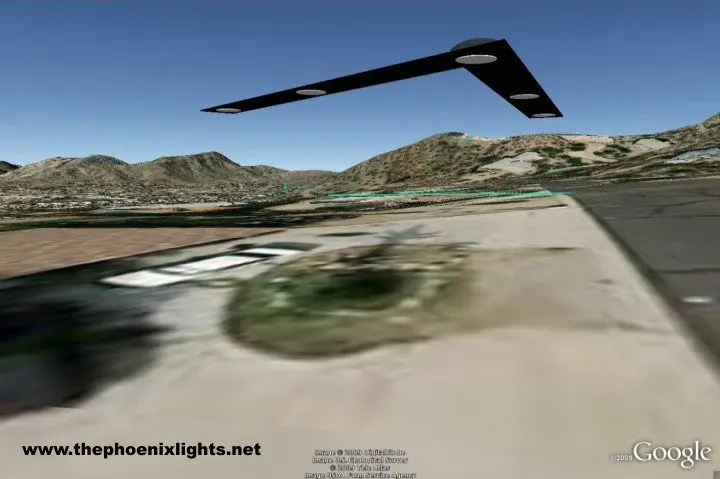 Here's an alt tag for the image: `Black boomerang-shaped UFO over desert`