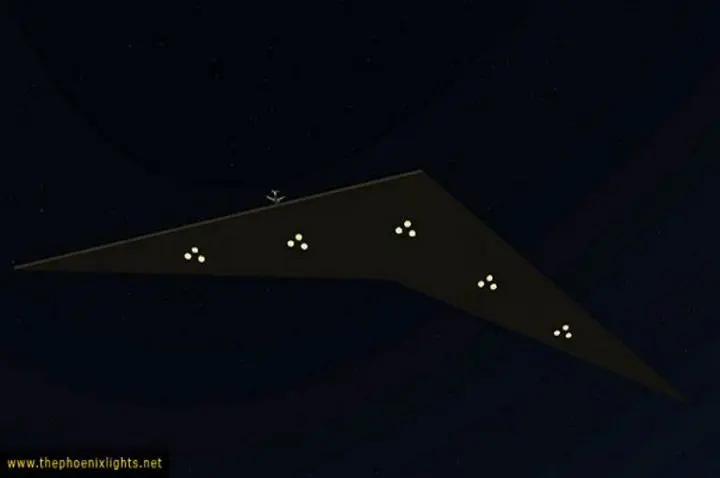 Here's an alt tag for the image: Triangular UFO with lights at night.