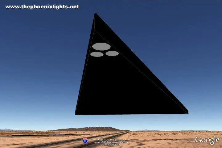 Black triangular UFO over desert.