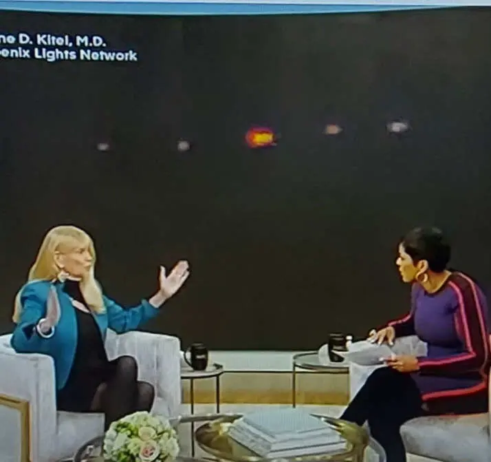 Two women in conversation on TV.