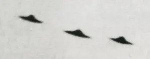 A black and white photo of an object in the sky.