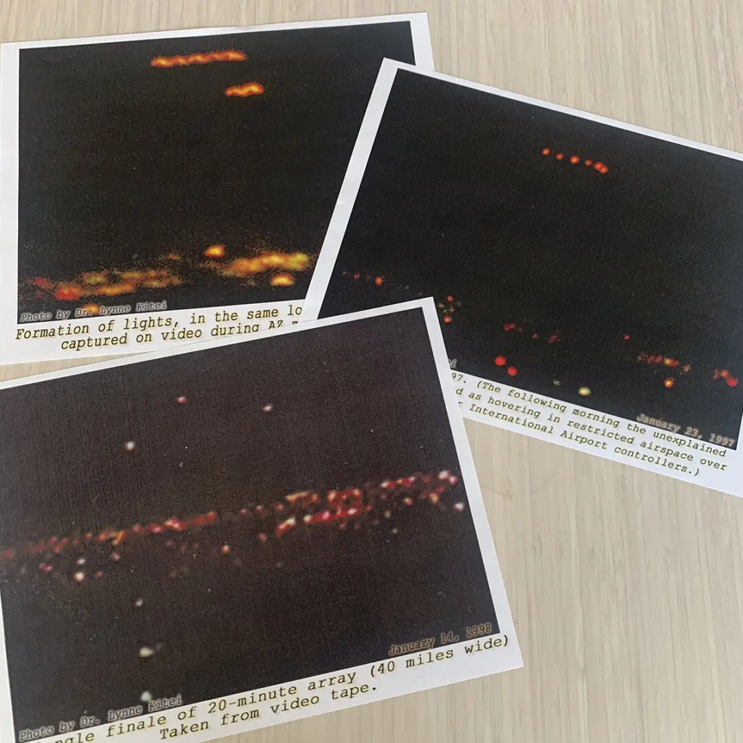 Three photographs of a city at night.