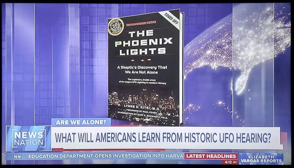 A book is sitting on top of the news desk.